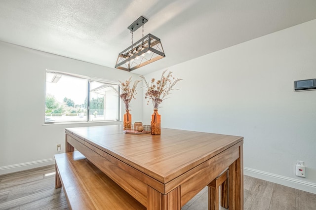 3377 N Bryan Ave, Fresno, CA 93723 - dining area featuring light wood-style flooring and baseboards