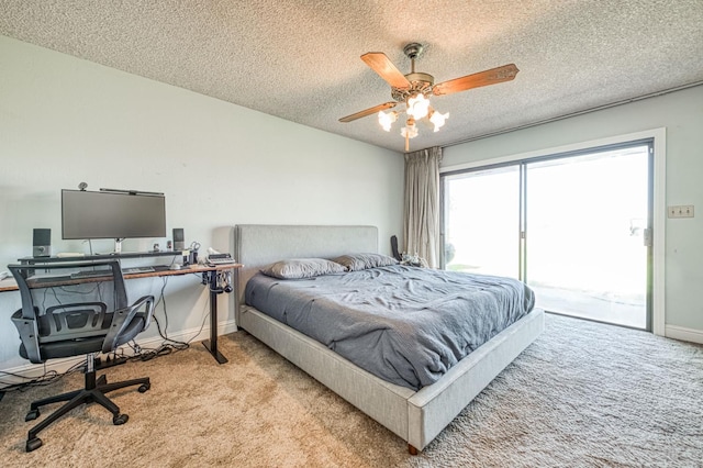 3377 N Bryan Ave, Fresno, CA 93723 - bedroom featuring carpet flooring, access to exterior, an office area, a textured ceiling, and ceiling fan