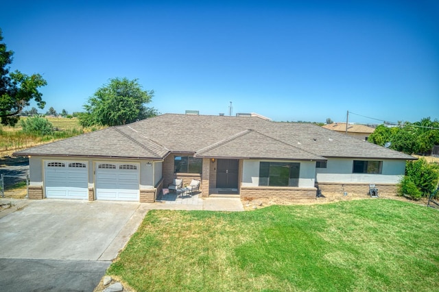 3377 N Bryan Ave, Fresno, CA 93723 - single story home with driveway, a garage, a front lawn, a shingled roof, and brick siding