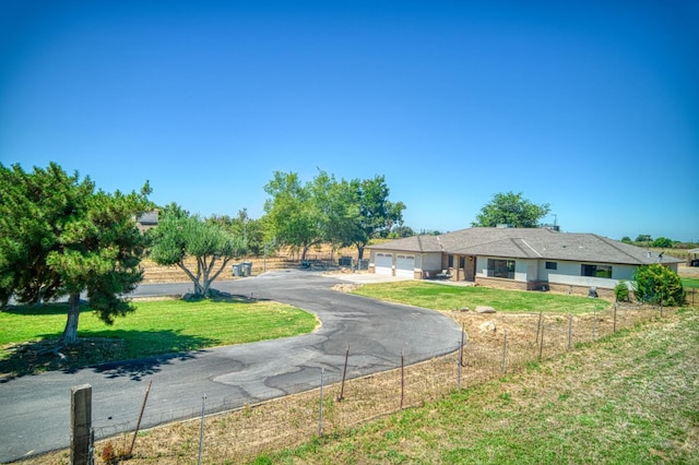 3377 N Bryan Ave, Fresno, CA 93723 - single story home with an attached garage and asphalt driveway