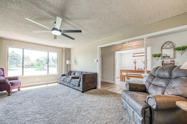 3377 N Bryan Ave, Fresno, CA 93723 - carpeted living room with a ceiling fan and a textured ceiling