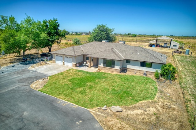 3377 N Bryan Ave, Fresno, CA 93723 - single story home with asphalt driveway, a garage, a front lawn, and a rural view