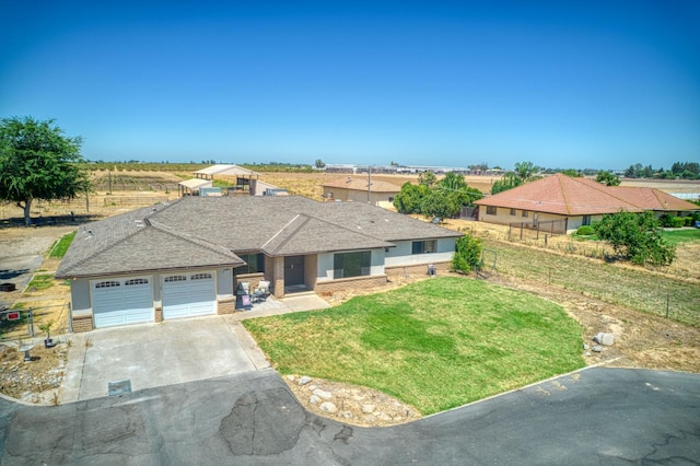 3377 N Bryan Ave, Fresno, CA 93723 - ranch-style house with driveway and a garage