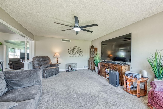 3377 N Bryan Ave, Fresno, CA 93723 - carpeted living area featuring ceiling fan and a textured ceiling