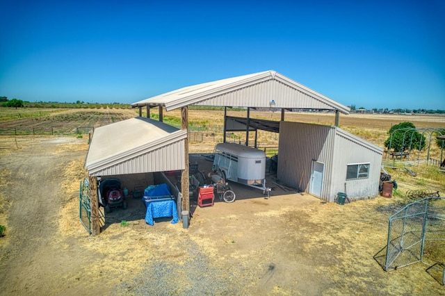 3377 N Bryan Ave, Fresno, CA 93723 - view of outdoor structure with a rural view and a detached carport
