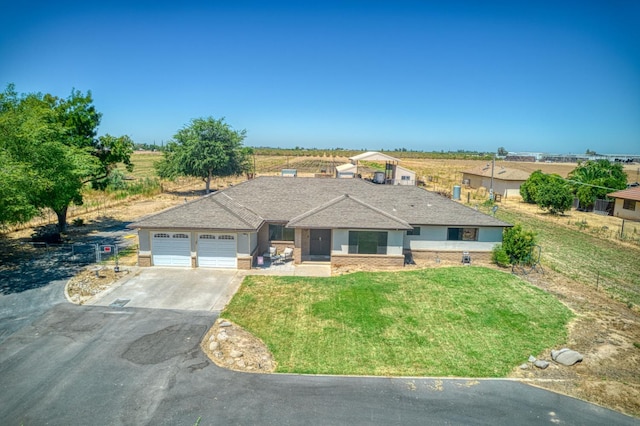 3377 N Bryan Ave, Fresno, CA 93723 - view of front of home featuring driveway, an attached garage, and a front lawn