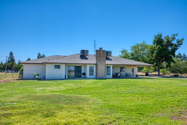 3377 N Bryan Ave, Fresno, CA 93723 - back of property with a chimney, a patio area, and stucco siding