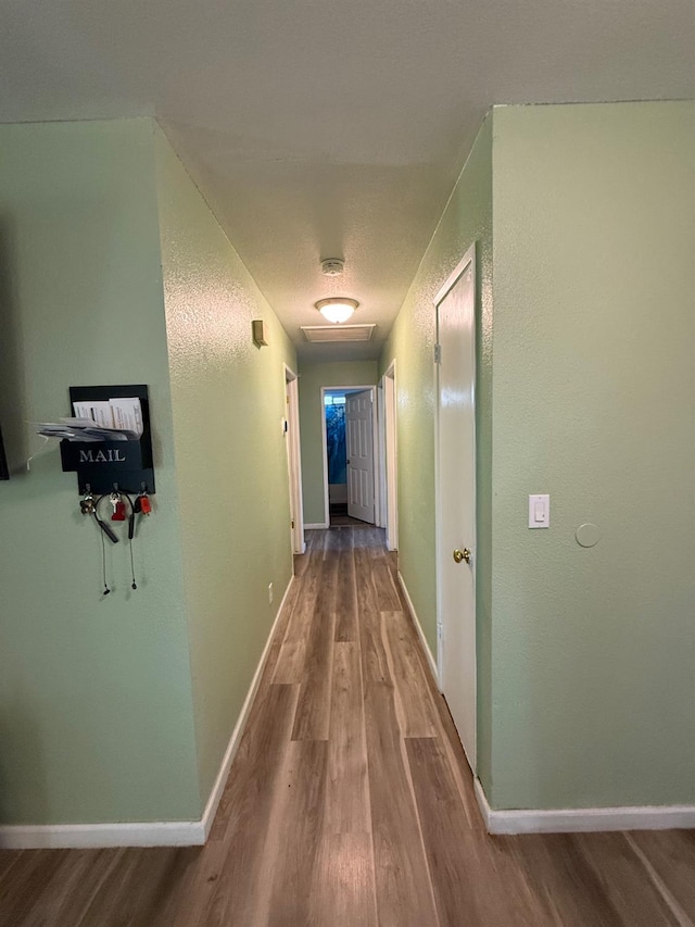 2662 Yerba St, Selma, CA 93662 - hallway featuring wood finished floors and baseboards