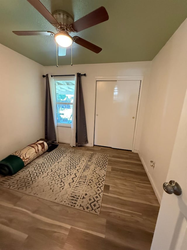 2662 Yerba St, Selma, CA 93662 - unfurnished bedroom with wood finished floors and a ceiling fan