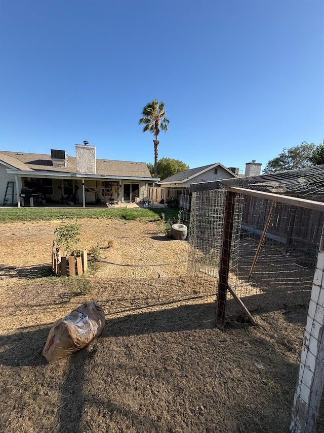 2662 Yerba St, Selma, CA 93662 - rear view of property featuring a chimney