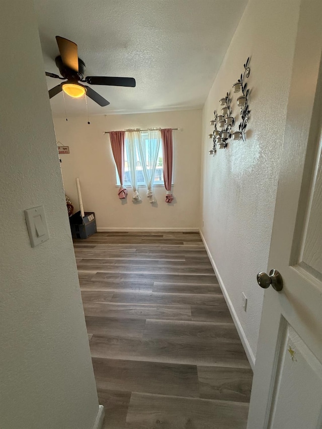 2662 Yerba St, Selma, CA 93662 - empty room with wood finished floors, a ceiling fan, a textured ceiling, and a textured wall