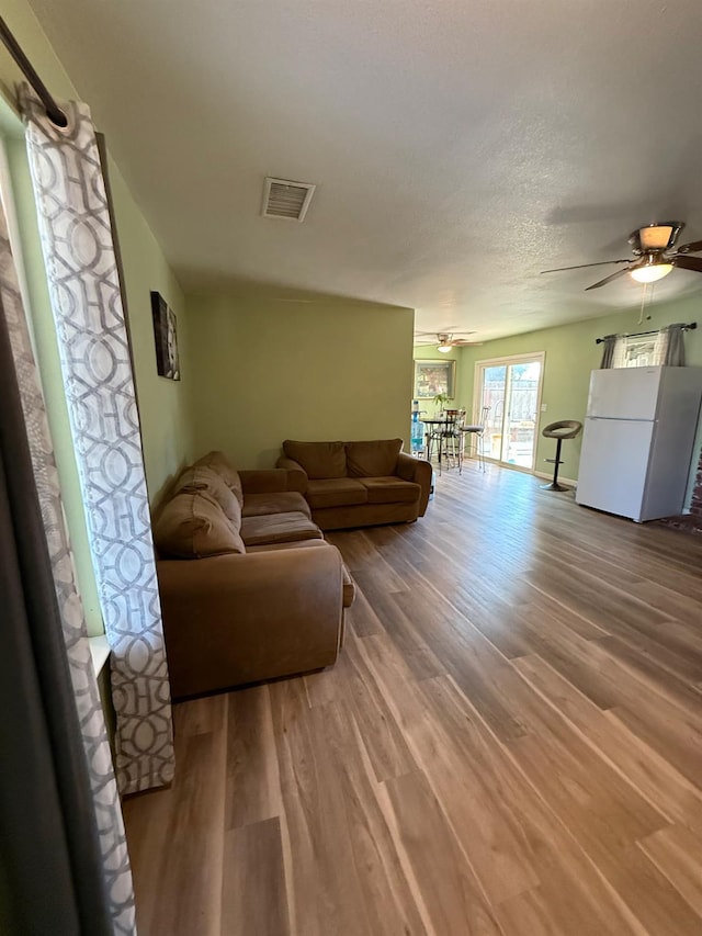2662 Yerba St, Selma, CA 93662 - living area with ceiling fan and wood finished floors