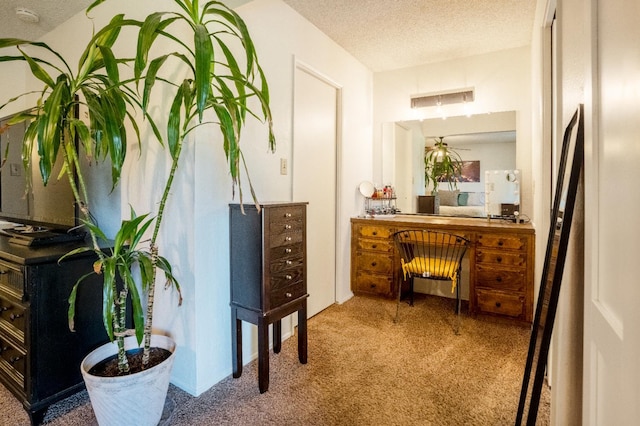 6372 N Benedict Ave, Fresno, CA 93711 - hallway featuring carpet floors and a textured ceiling