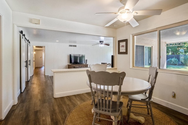 6372 N Benedict Ave, Fresno, CA 93711 - dining area featuring dark wood-type flooring, ceiling fan, and a barn door