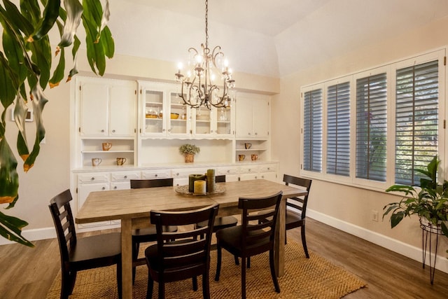 6372 N Benedict Ave, Fresno, CA 93711 - dining space with a chandelier, dark wood-style floors, and lofted ceiling