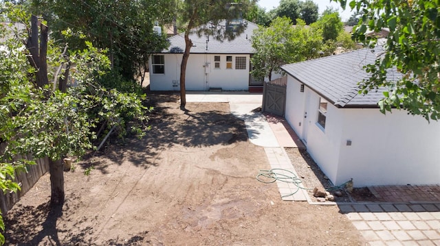 4119 Arden Dr S, Fresno, CA 93703 - rear view of property featuring stucco siding and a patio area