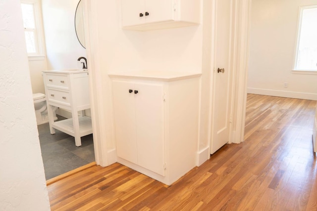 4119 Arden Dr S, Fresno, CA 93703 - hallway featuring light wood finished floors and baseboards