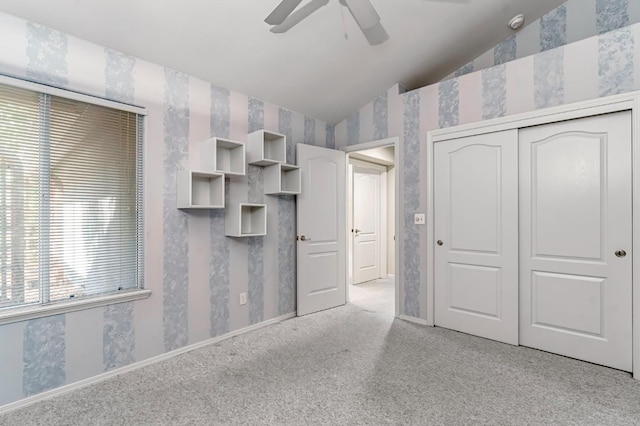 1210 E Province Dr, Fresno, CA 93720 - unfurnished bedroom featuring lofted ceiling, wallpapered walls, light colored carpet, a closet, and a ceiling fan