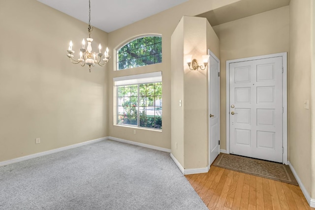 1210 E Province Dr, Fresno, CA 93720 - entrance foyer with a chandelier and light wood-style floors