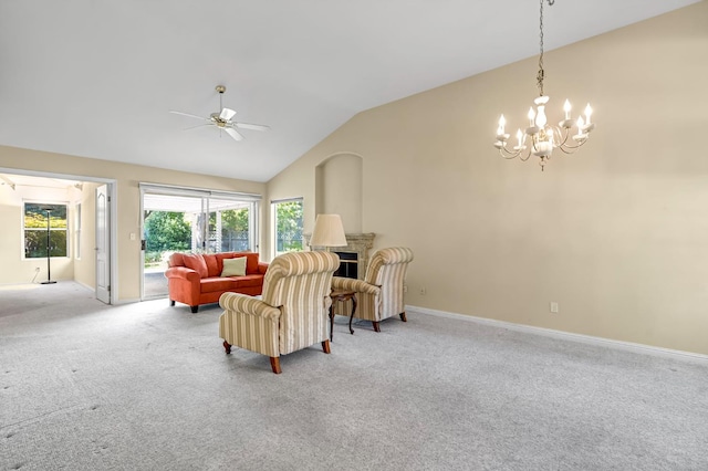 1210 E Province Dr, Fresno, CA 93720 - living area featuring vaulted ceiling, light carpet, a ceiling fan, a fireplace, and a chandelier