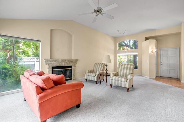 1210 E Province Dr, Fresno, CA 93720 - living area with healthy amount of natural light, a fireplace, carpet, and vaulted ceiling