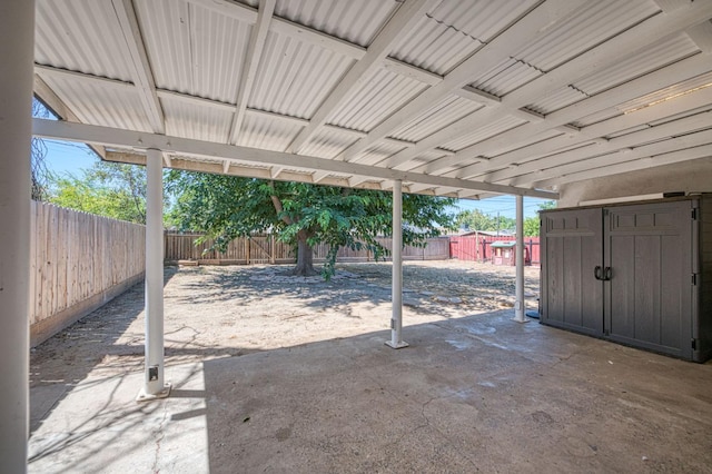 1821 W Lansing Way, Fresno, CA 93705 - fenced backyard with a patio and a storage shed