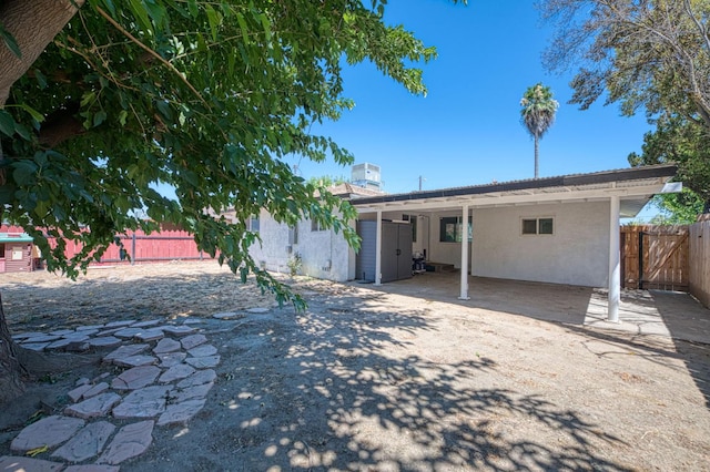 1821 W Lansing Way, Fresno, CA 93705 - back of house with a patio area and stucco siding