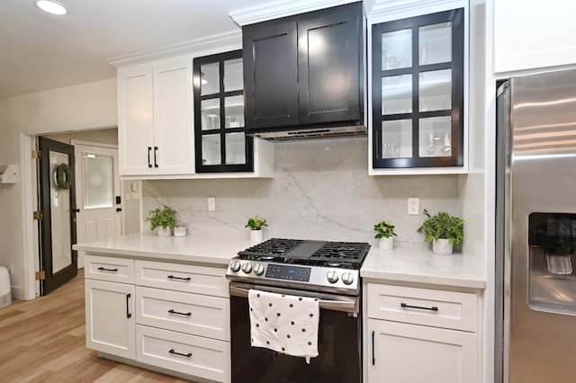 25190 Elwood Rd, Sanger, CA 93657 - kitchen with stainless steel appliances, tasteful backsplash, glass insert cabinets, white cabinetry, and recessed lighting