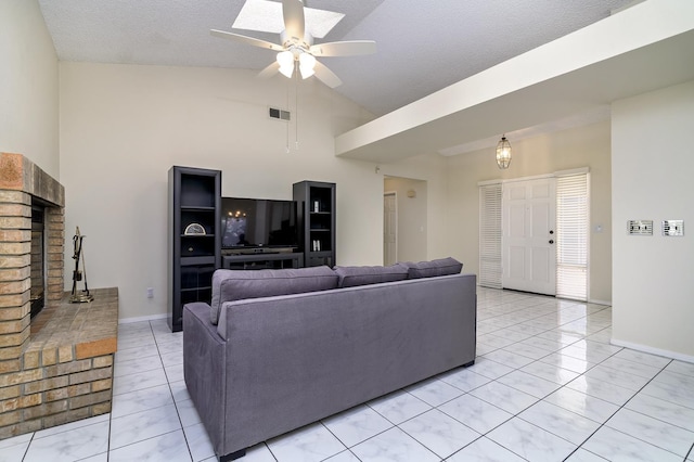 6447 N Vagedes Ave, Fresno, CA 93711 - living room featuring ceiling fan, light tile patterned floors, a fireplace, high vaulted ceiling, and a textured ceiling