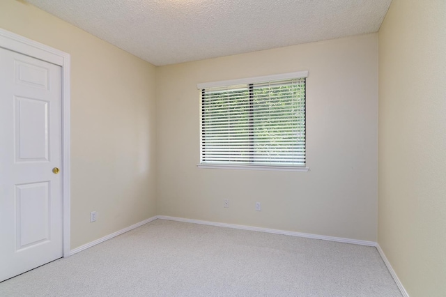 6447 N Vagedes Ave, Fresno, CA 93711 - carpeted empty room with a textured ceiling and baseboards