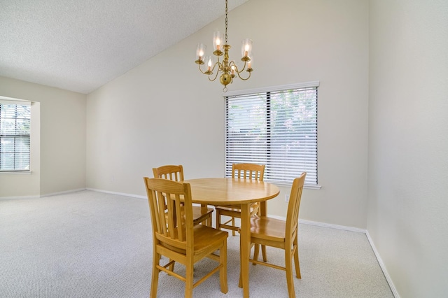 6447 N Vagedes Ave, Fresno, CA 93711 - carpeted dining space featuring vaulted ceiling, a chandelier, and a textured ceiling