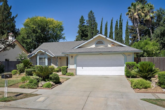6447 N Vagedes Ave, Fresno, CA 93711 - single story home with concrete driveway, a garage, and brick siding