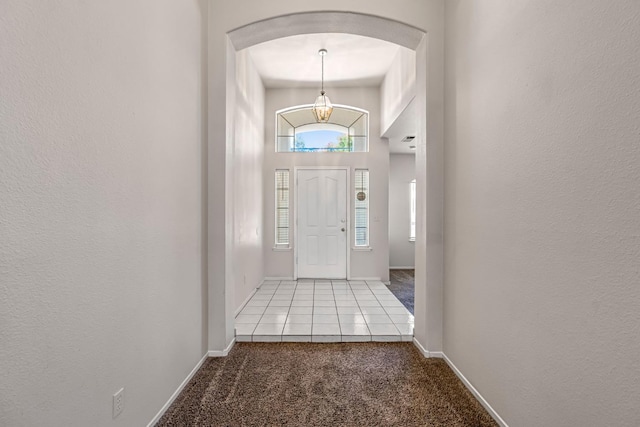 5811 W Beechwood Ave, Fresno, CA 93722 - entryway featuring carpet flooring and arched walkways