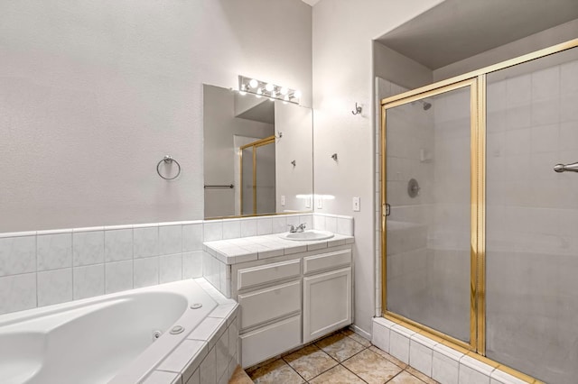 5811 W Beechwood Ave, Fresno, CA 93722 - full bath featuring a shower stall, a bath, vanity, and tile patterned floors