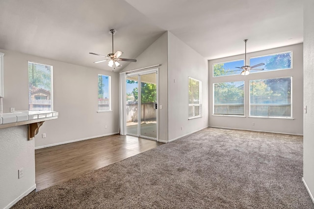 5811 W Beechwood Ave, Fresno, CA 93722 - unfurnished living room with a ceiling fan, carpet floors, plenty of natural light, and lofted ceiling