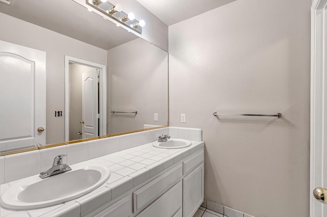 5811 W Beechwood Ave, Fresno, CA 93722 - bathroom with double vanity and tile patterned floors
