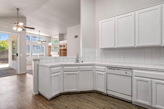 5811 W Beechwood Ave, Fresno, CA 93722 - kitchen with dishwasher, a ceiling fan, tile counters, backsplash, and dark wood finished floors