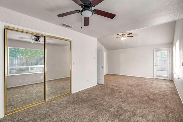 5811 W Beechwood Ave, Fresno, CA 93722 - unfurnished living room featuring carpet floors, a ceiling fan, and vaulted ceiling