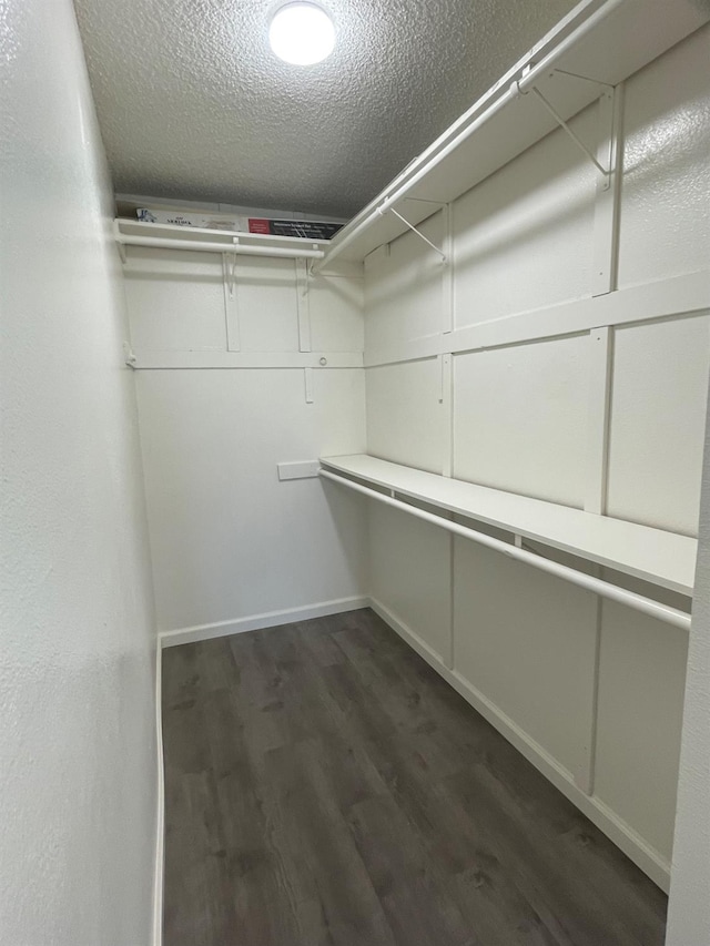 1027 W Dakota Ave Unit 102, Fresno, CA 93705 - spacious closet featuring dark wood finished floors