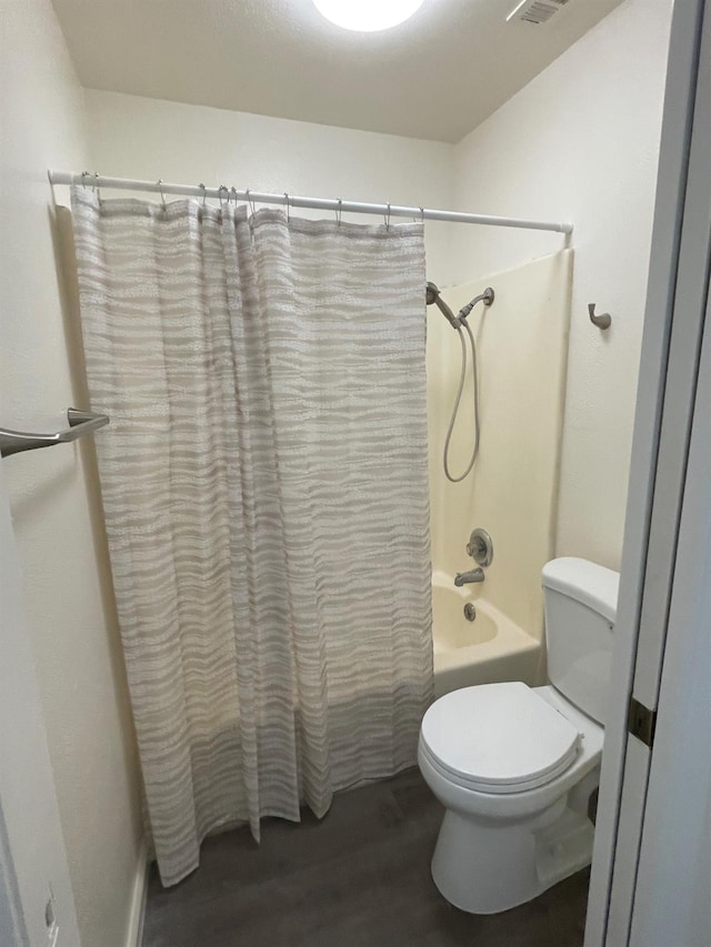 1027 W Dakota Ave Unit 102, Fresno, CA 93705 - full bath featuring shower / bath combination with curtain and wood finished floors