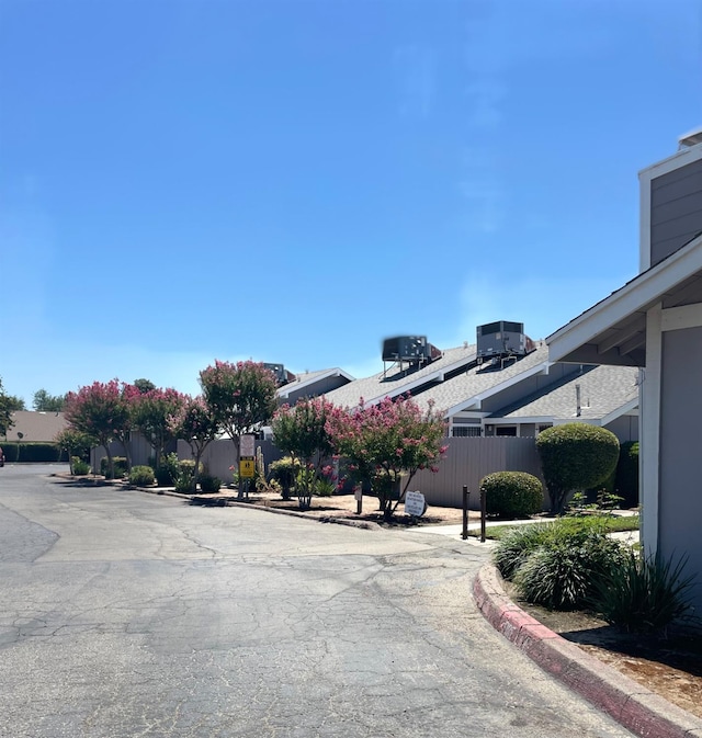 1027 W Dakota Ave Unit 102, Fresno, CA 93705 - view of asphalt road featuring curbs