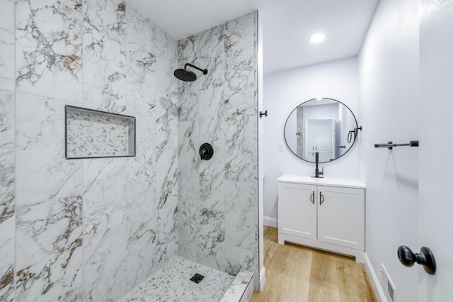 1904 S Fairway Ave, Fresno, CA 93727 - bathroom featuring a marble finish shower, vanity, and wood finished floors