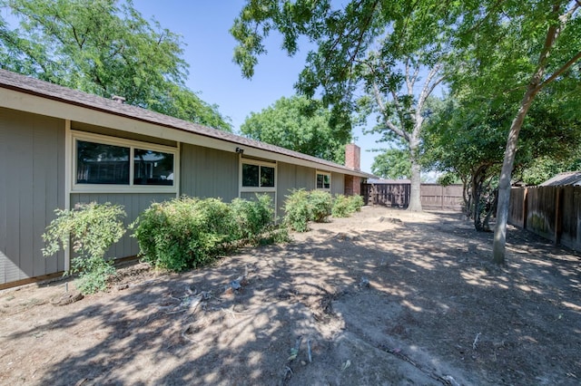 1904 S Fairway Ave, Fresno, CA 93727 - view of side of home featuring a fenced backyard and a chimney