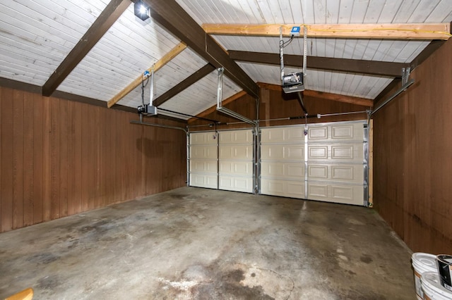 1904 S Fairway Ave, Fresno, CA 93727 - garage with a garage door opener and wood walls
