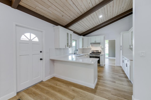 1904 S Fairway Ave, Fresno, CA 93727 - kitchen with stainless steel range oven, wooden ceiling, light countertops, light wood-style flooring, and white cabinetry