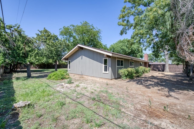 1904 S Fairway Ave, Fresno, CA 93727 - rear view of property with a chimney