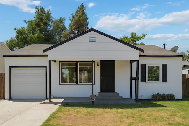 1402 E Shields Ave, Fresno, CA 93704 - view of front of property with a garage, driveway, and stucco siding