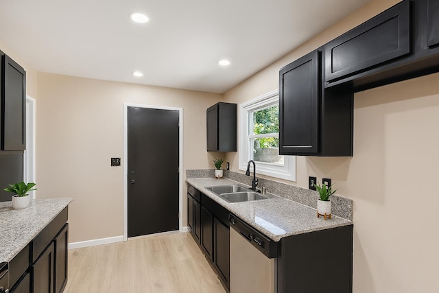 1402 E Shields Ave, Fresno, CA 93704 - kitchen with stainless steel dishwasher, light wood finished floors, dark cabinetry, recessed lighting, and light stone countertops