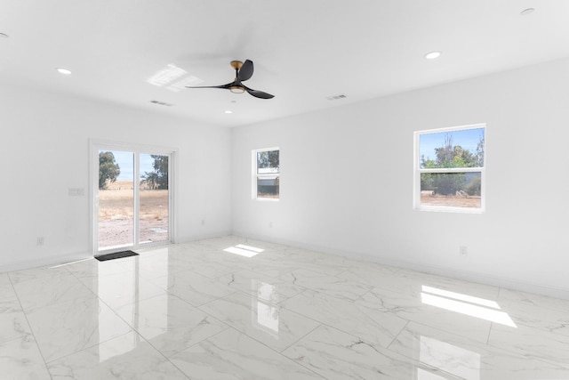 36950 Pauline Ave, Madera, CA 93636 - unfurnished room featuring plenty of natural light, ceiling fan, light marble finish floors, and recessed lighting