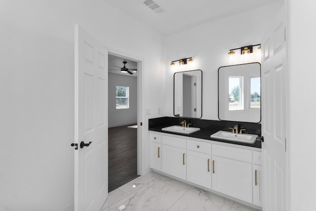 36950 Pauline Ave, Madera, CA 93636 - bathroom featuring double vanity, a ceiling fan, and marble finish floors